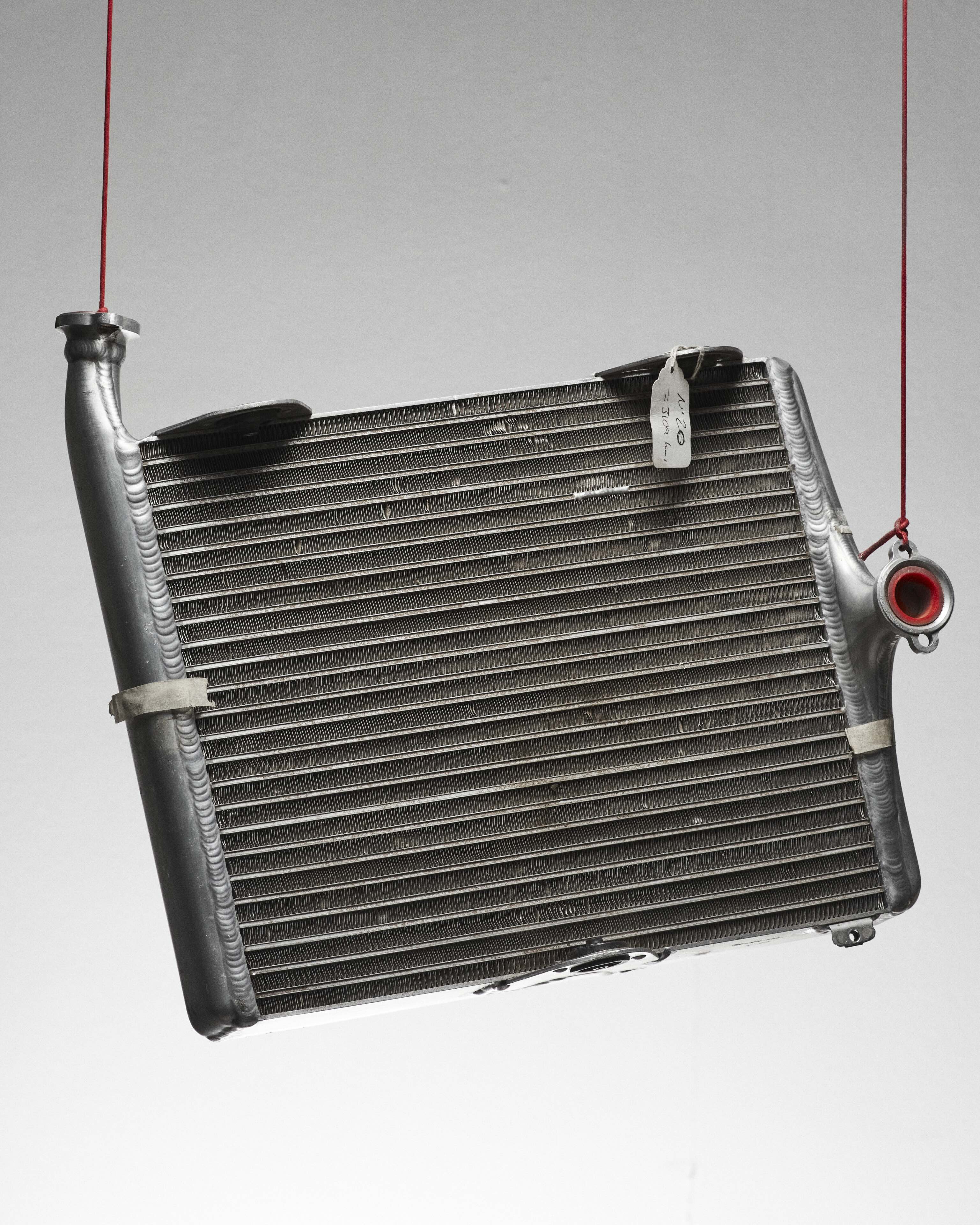 F1 radiator hanging on a red silk cord 